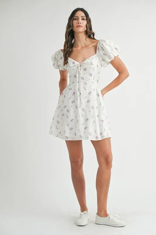 Pear Daisy MABLE floral print puff sleeve mini dress, stylish home décor with vibrant floral pattern and puff sleeve design.
