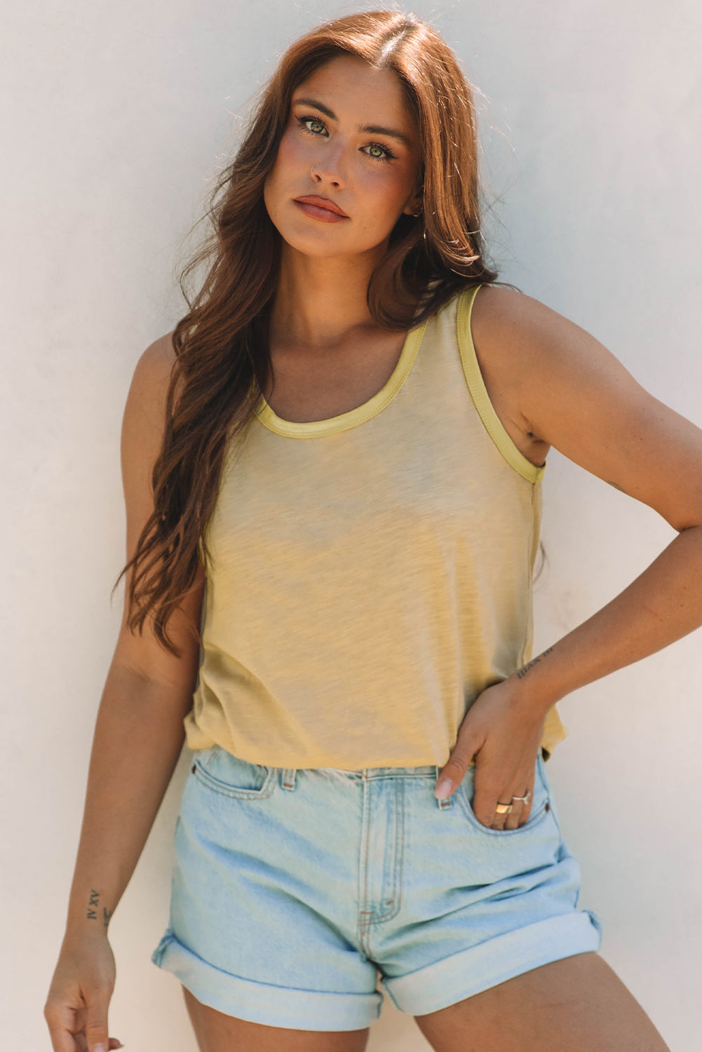 Metallic contrast trim scoop neck tank top for women by Byzantium Bay, featuring shiny accents and a fitted sleeveless design.