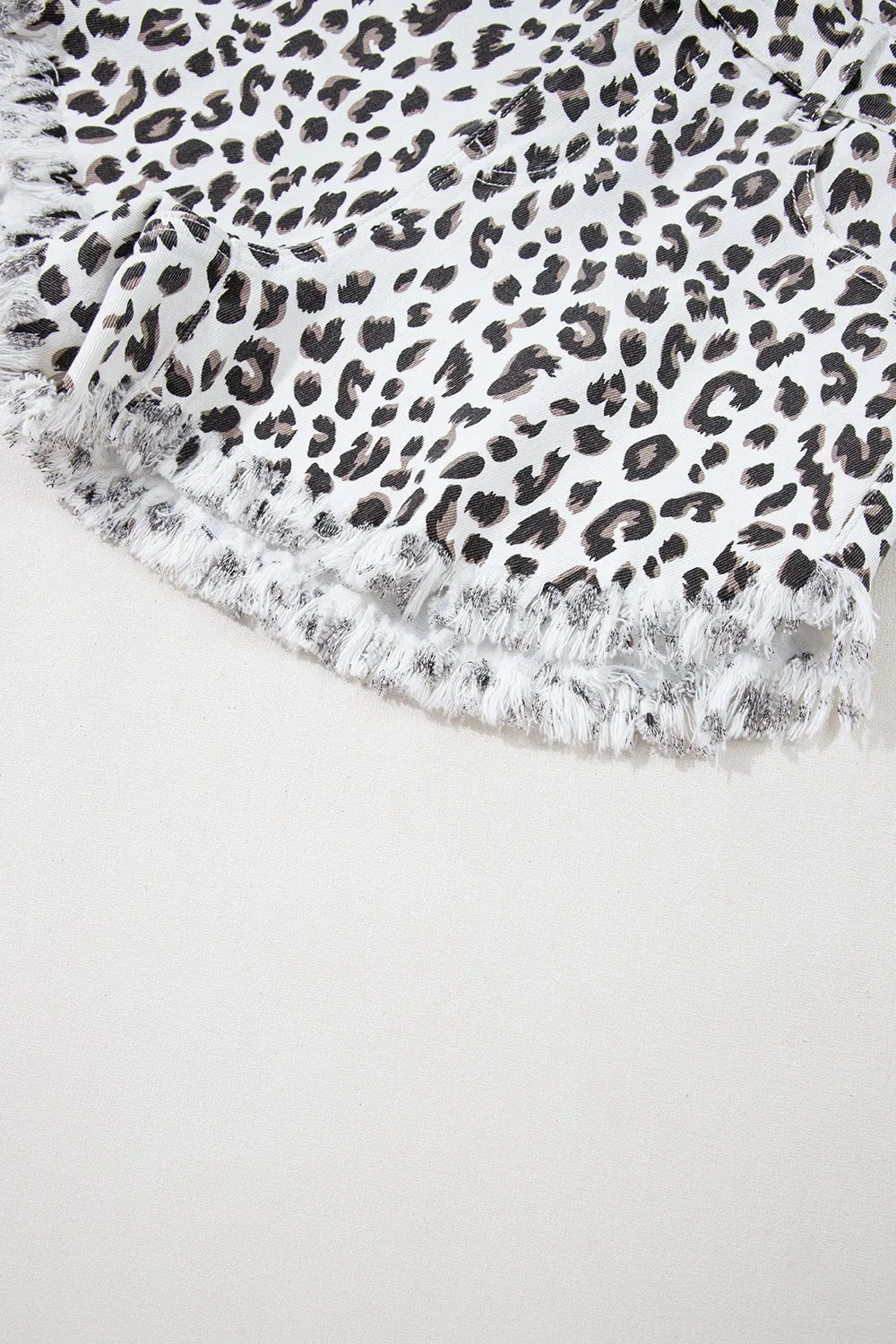 Leopard print frayed hem denim shorts for women by Ruby Styx, showcasing a stylish, casual summer fashion look.