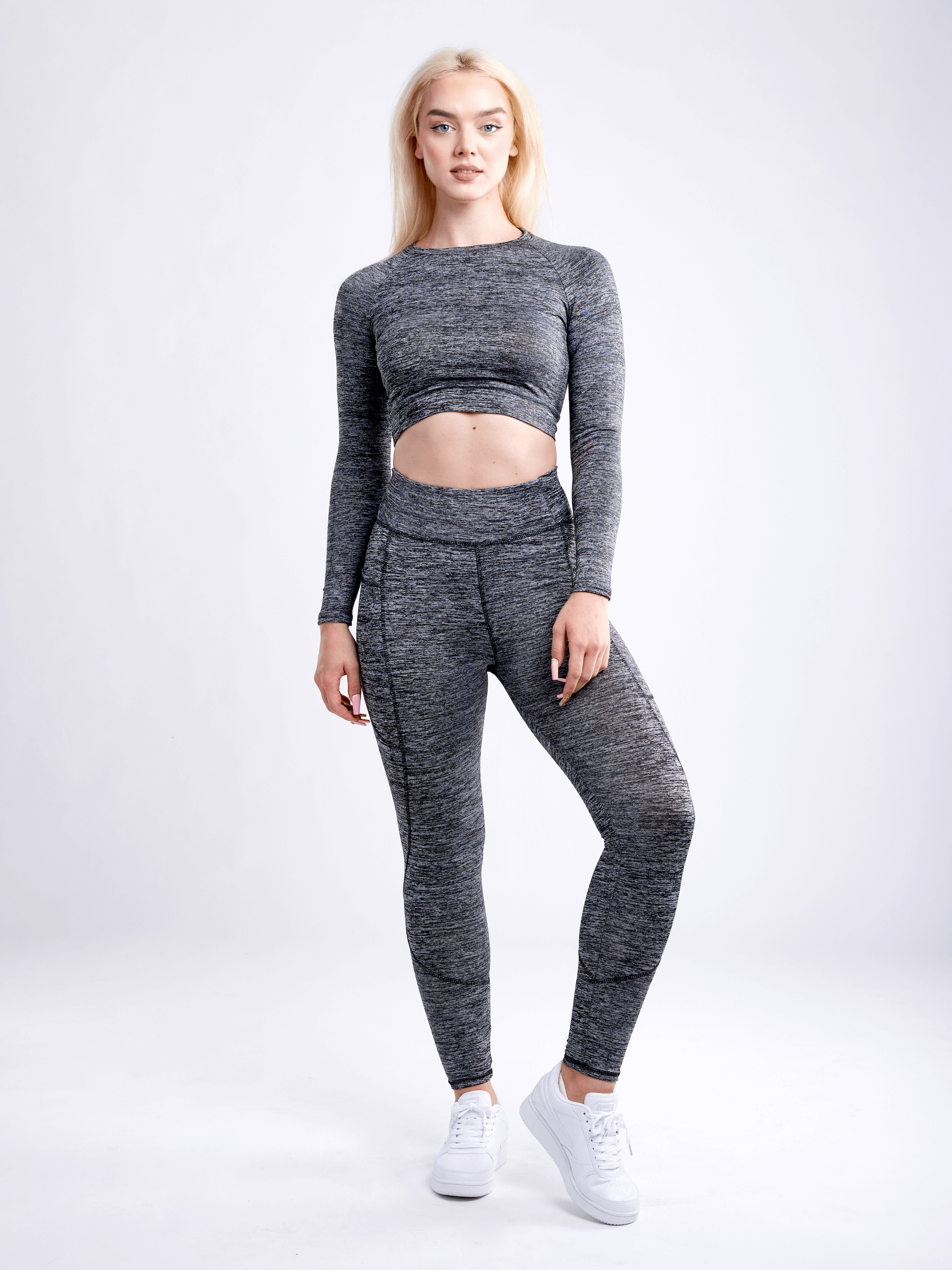 Black Lavender JupiterGear long-sleeve crop top, stylish activewear with a fitted design, shown in a sleek black fabric.