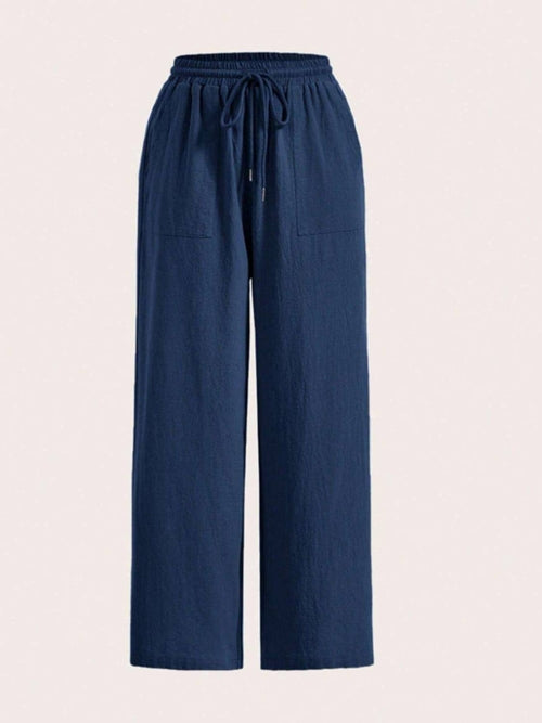 Carmine Juneberry drawstring wide-leg pants in lightweight fabric, featuring a relaxed fit and adjustable waistband.