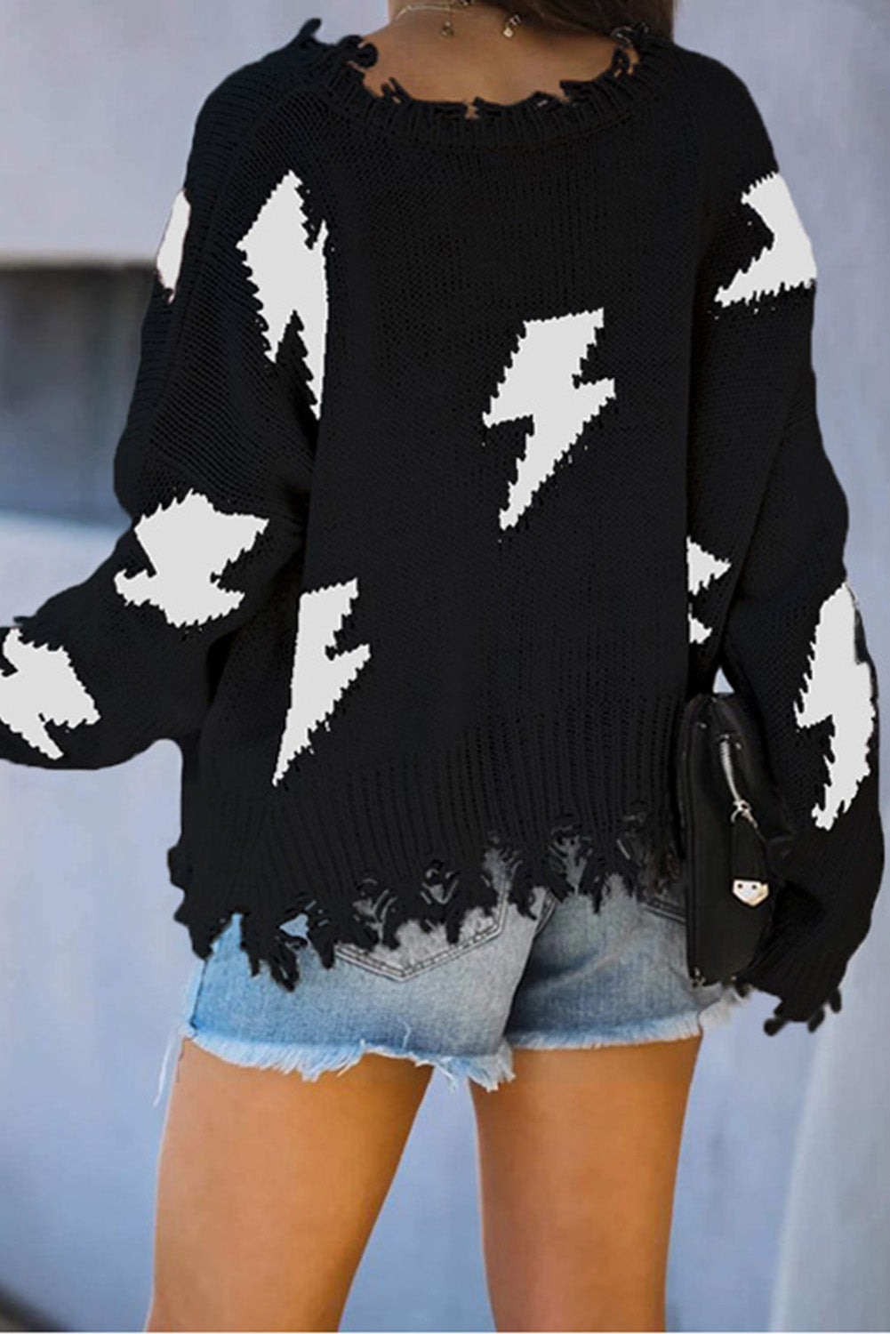 Blacki distressed knit bolt sweater by Harlequin Daisy, featuring a cozy, textured black sweater with a distressed design.