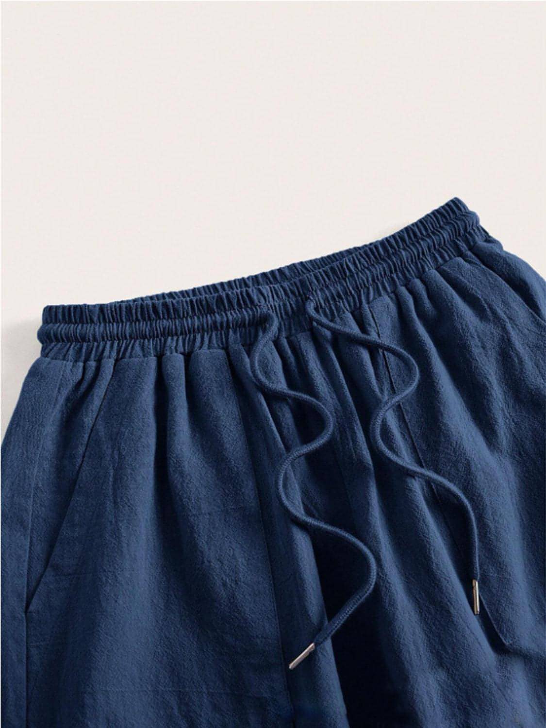Carmine Juneberry drawstring wide-leg pants in a relaxed fit, featuring a high waist and flowing fabric.