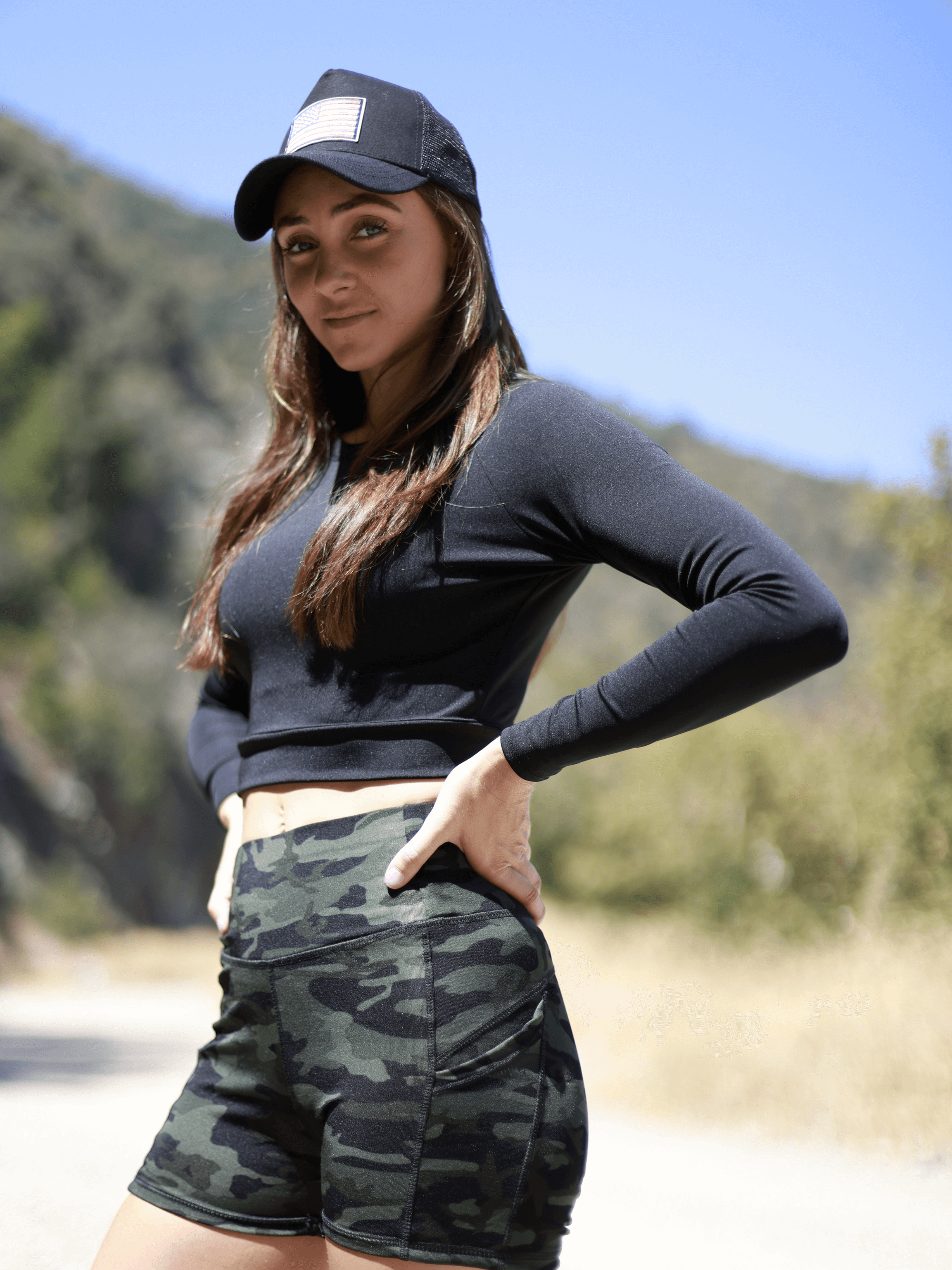 Black Lavender JupiterGear long-sleeve crop top for activewear, featuring a fitted design and subtle branding, shown on a neutral background.