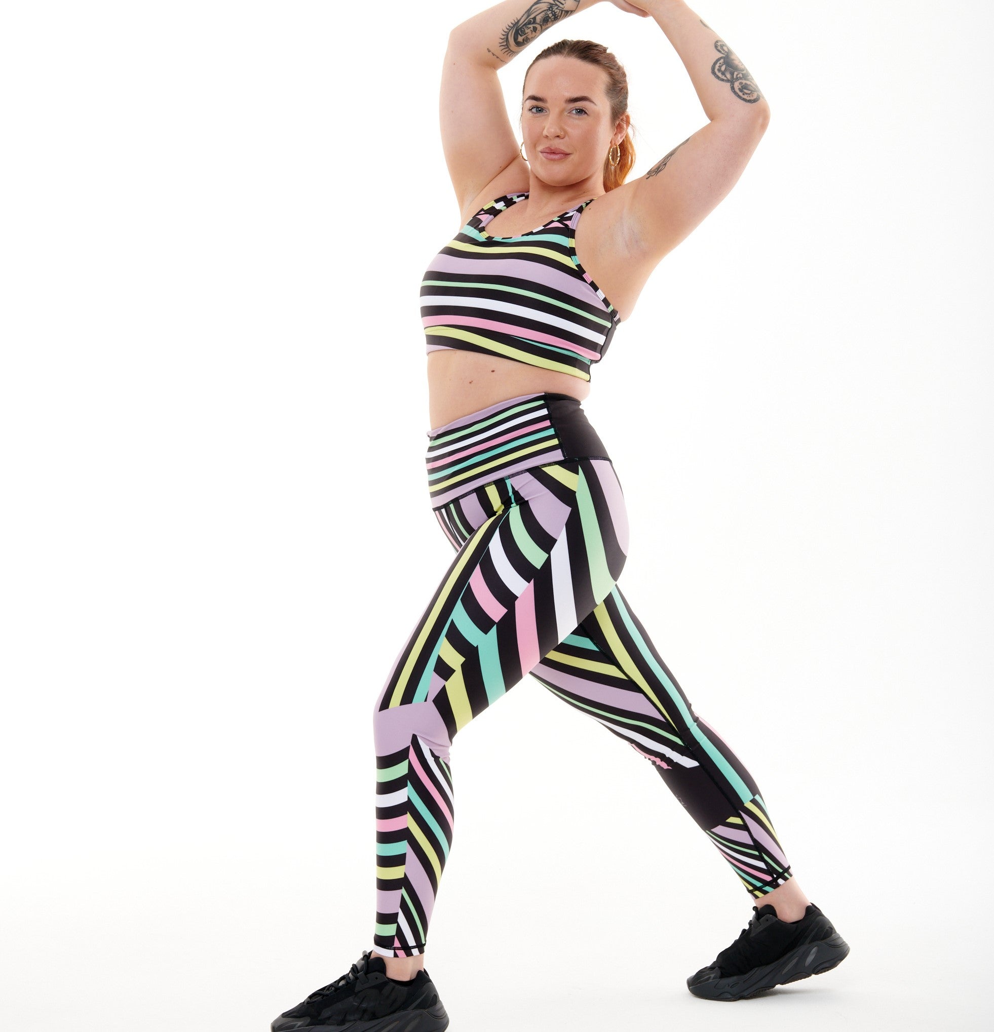 White Oliver Aso-Oke pastel vibrant leggings for activewear, featuring colorful traditional-inspired patterns and a comfortable fit.
