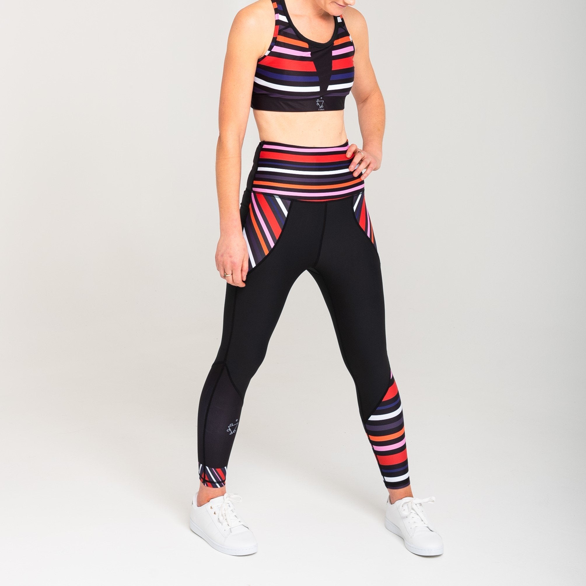 White Oliver Aso-Oke leggings for activewear featuring vibrant, traditional Nigerian fabric design and a comfortable fit.