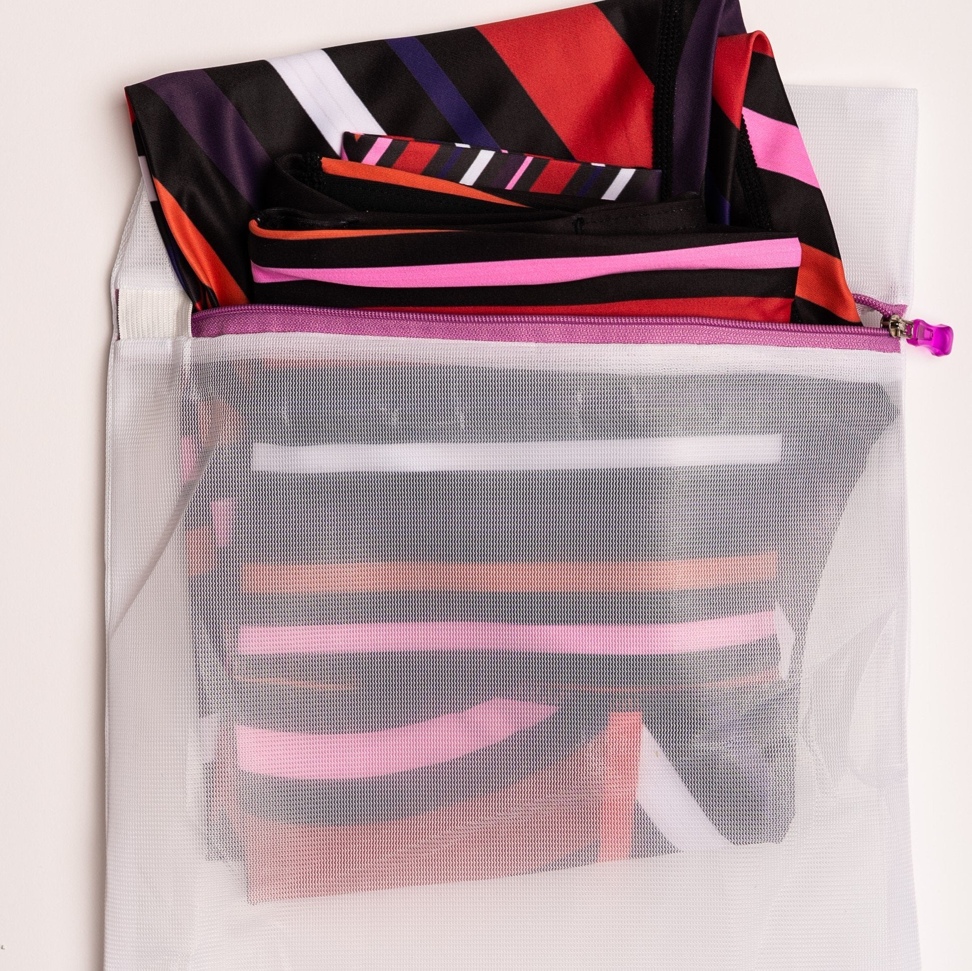 Vibrant Aso-Oke patterned leggings by White Oliver for activewear, featuring colorful traditional African fabric design.