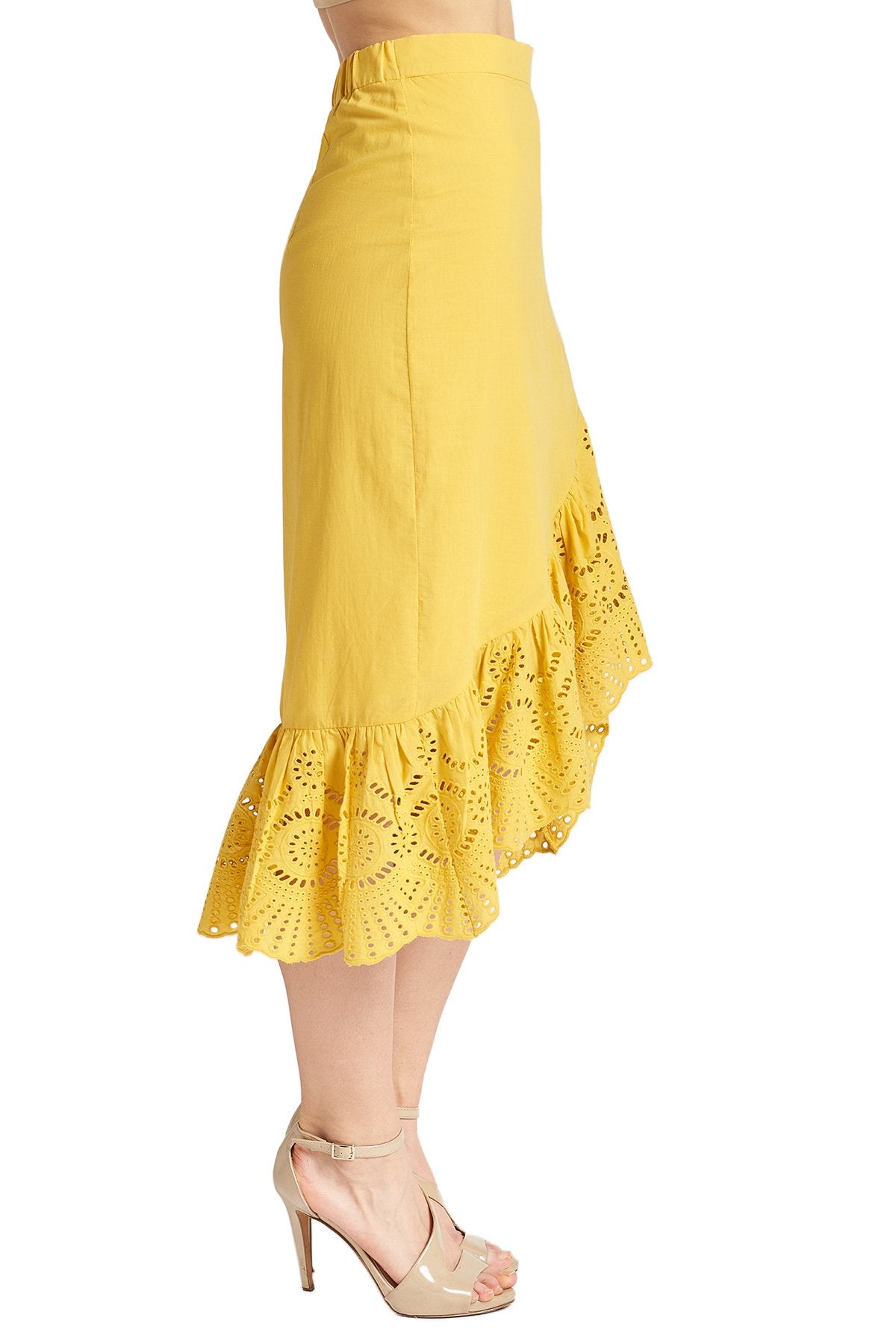 Marigold cotton eyelet Aster Skirt by Peach Dionysus featuring an asymmetric hi-lo design and delicate floral detailing.