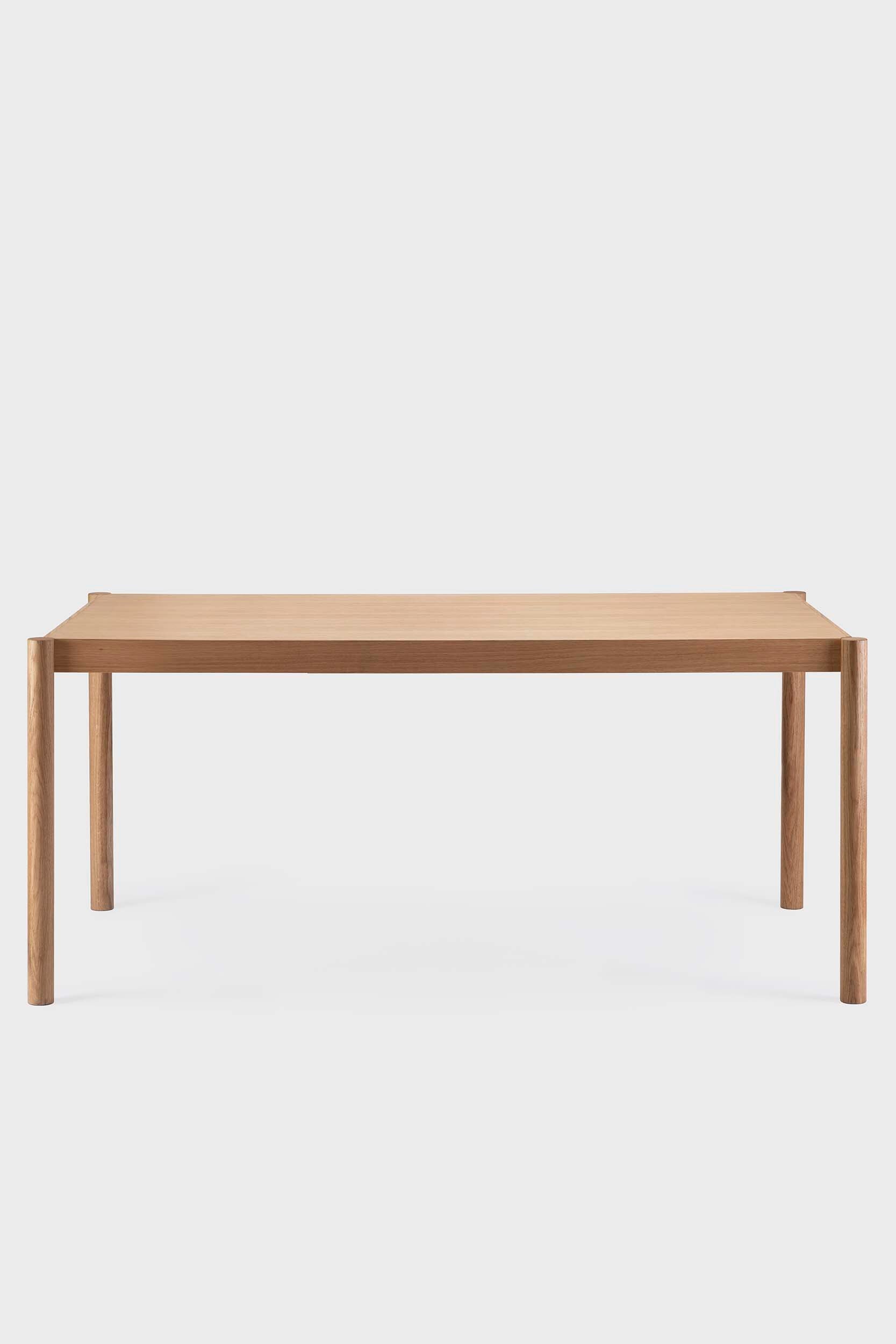 Natural wood Citizen dining table by Aquamarine Poppy, showcasing a modern furniture design with a smooth tabletop and sturdy legs.