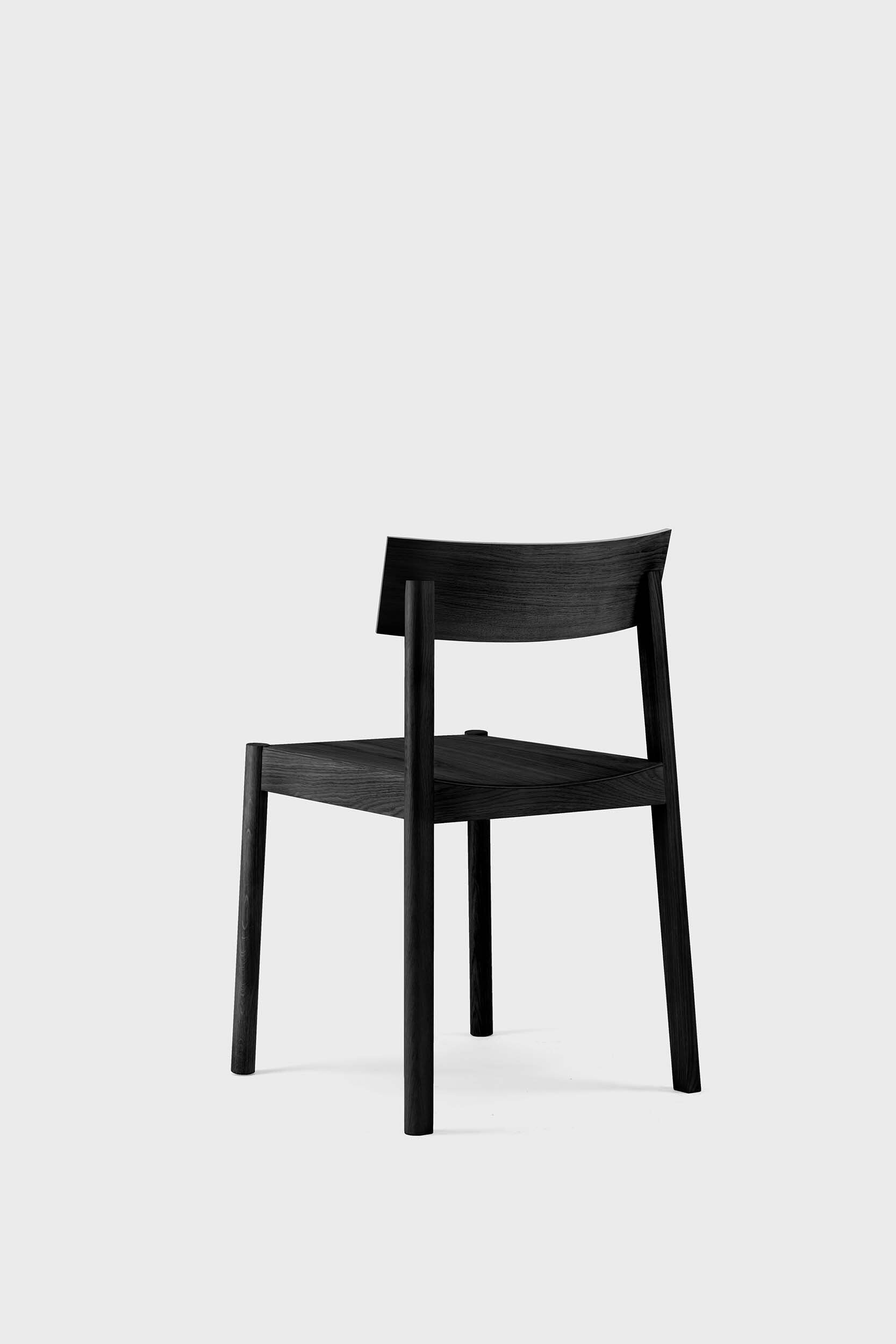 Dark brown Citizen dining chair by Aquamarine Poppy, featuring a wooden frame and cushioned seat for modern dining room decor.