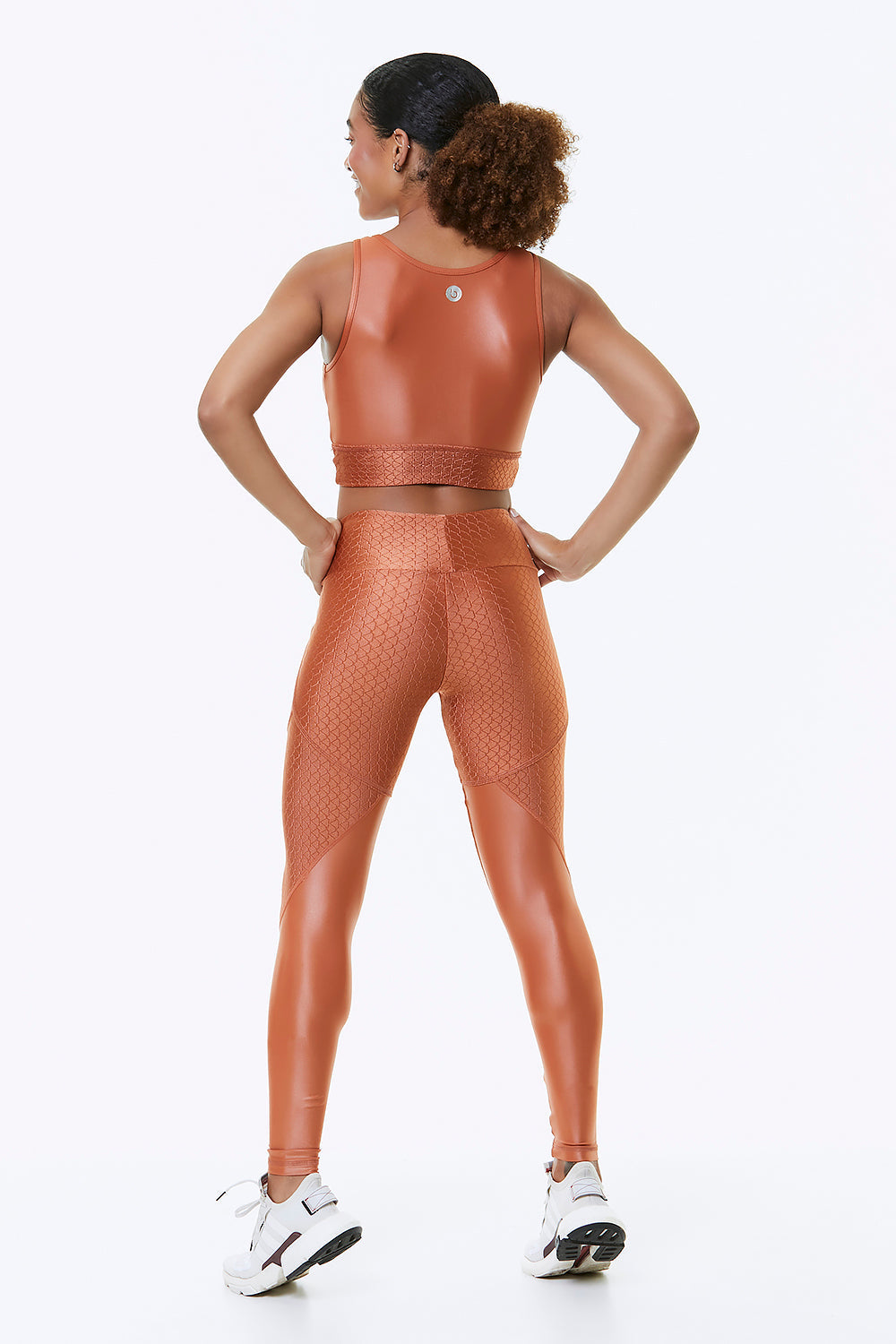 Orange blossom cropped sports bra from Red Medusa activewear, shown from the back with supportive straps and vibrant color.