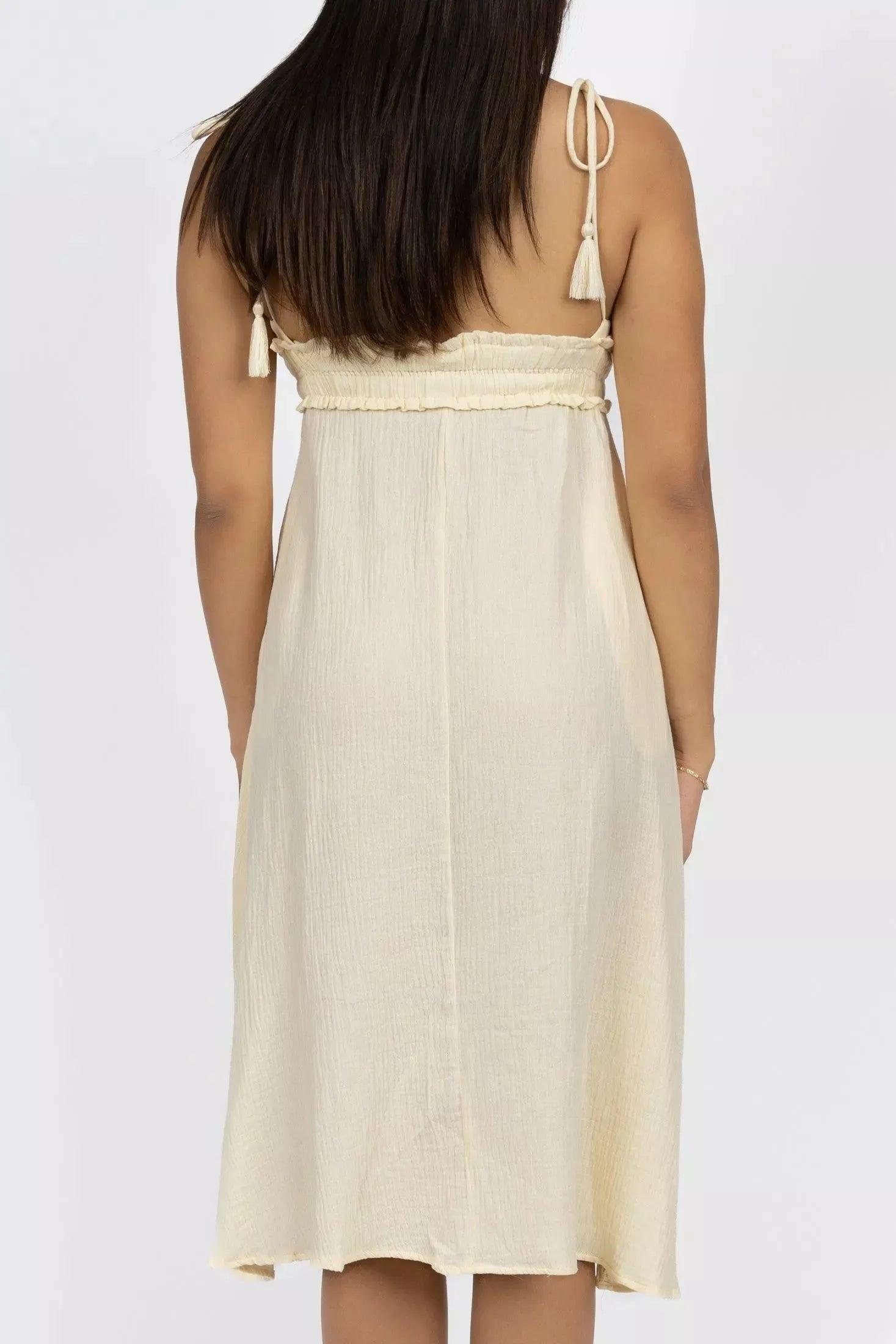 Cream pet costume resembling a midi dress with V-neck and spaghetti straps from Burgundy Perses for pets.