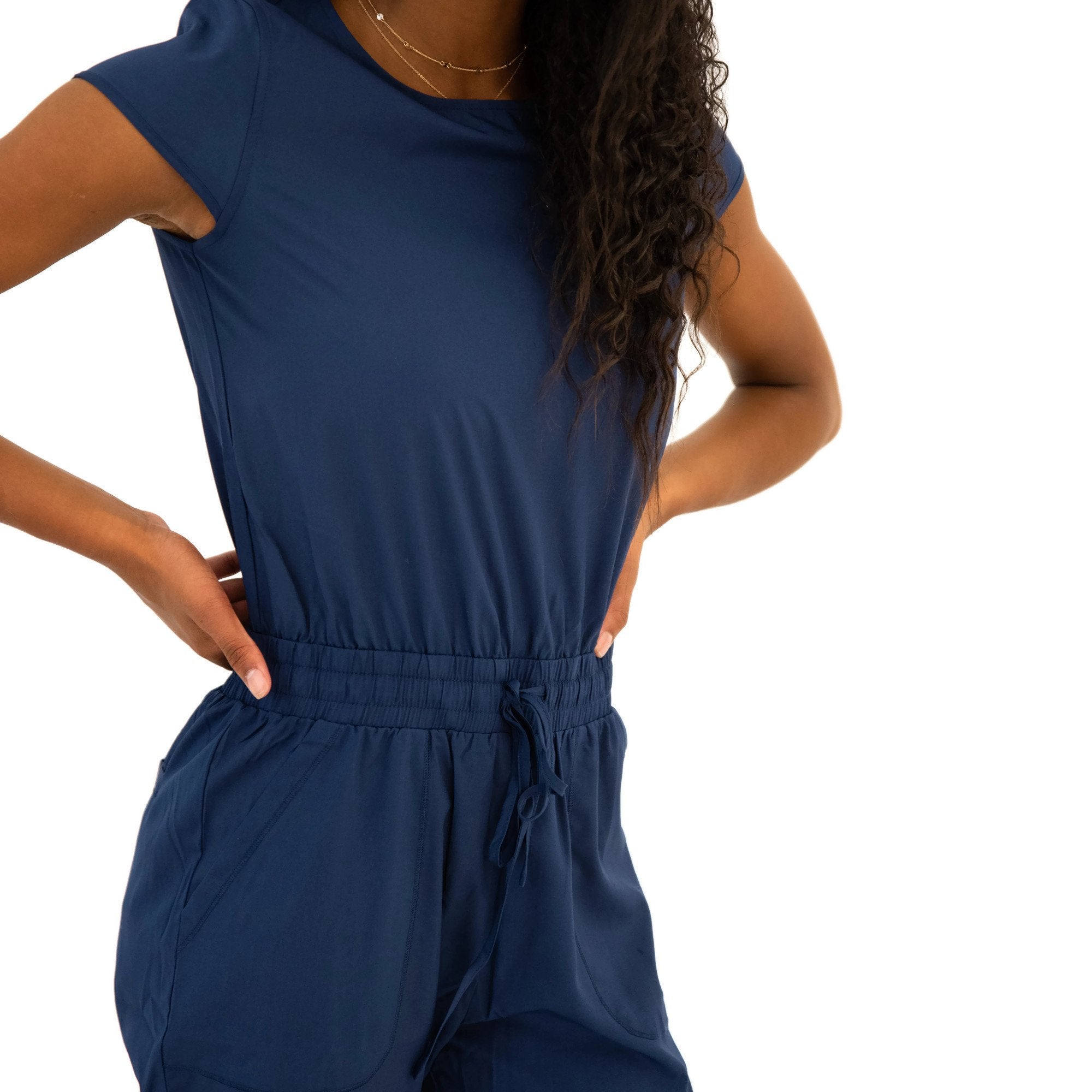 Lavender Danae DT Unity navy jumpsuit for women, featuring a stylish and comfortable one-piece clothing design.