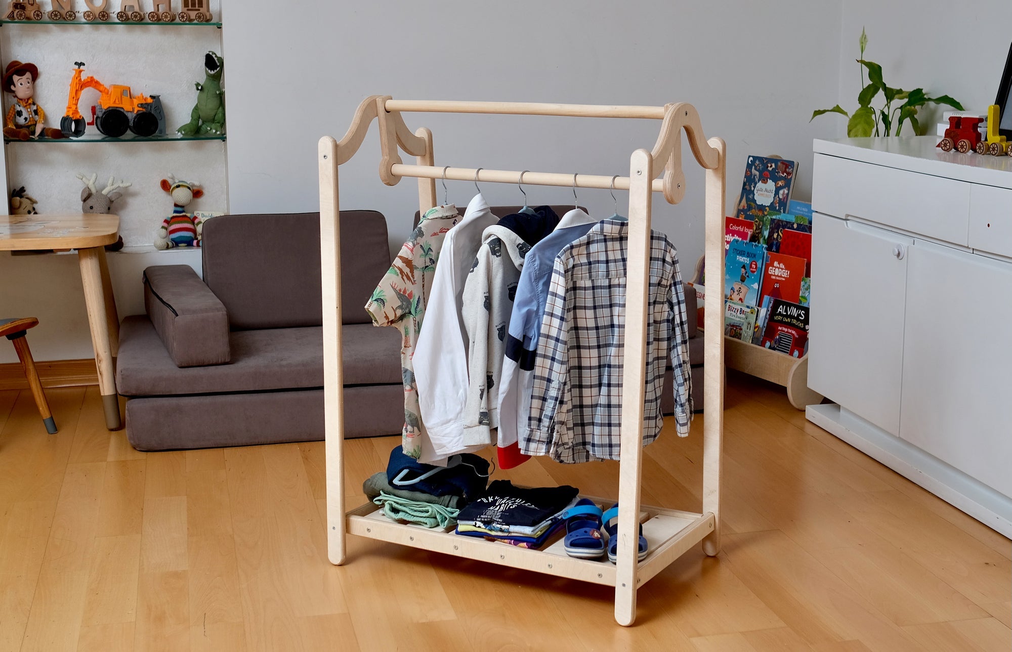 Wooden kids clothing rack by Red Oceanus, featuring a sturdy furniture piece with hooks and shelves for children&