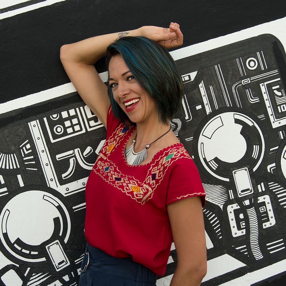 Red huipil blouse for women with colorful hand-stitched details, by Violet Athena, showcasing traditional craftsmanship.