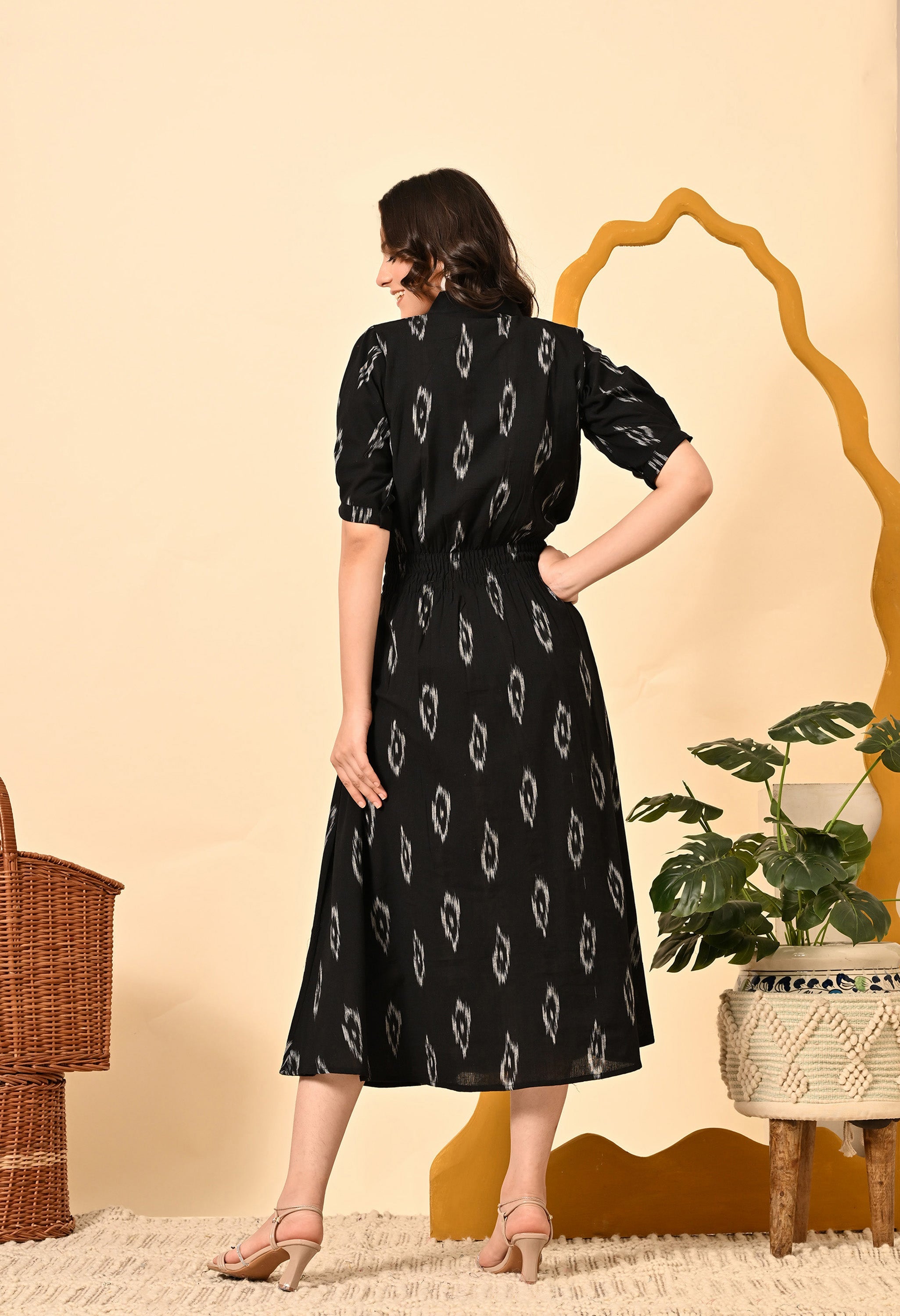 Black Diamond elasticated midi dress for women by Periwinkle Tiger, featuring a fitted silhouette and stylish design.