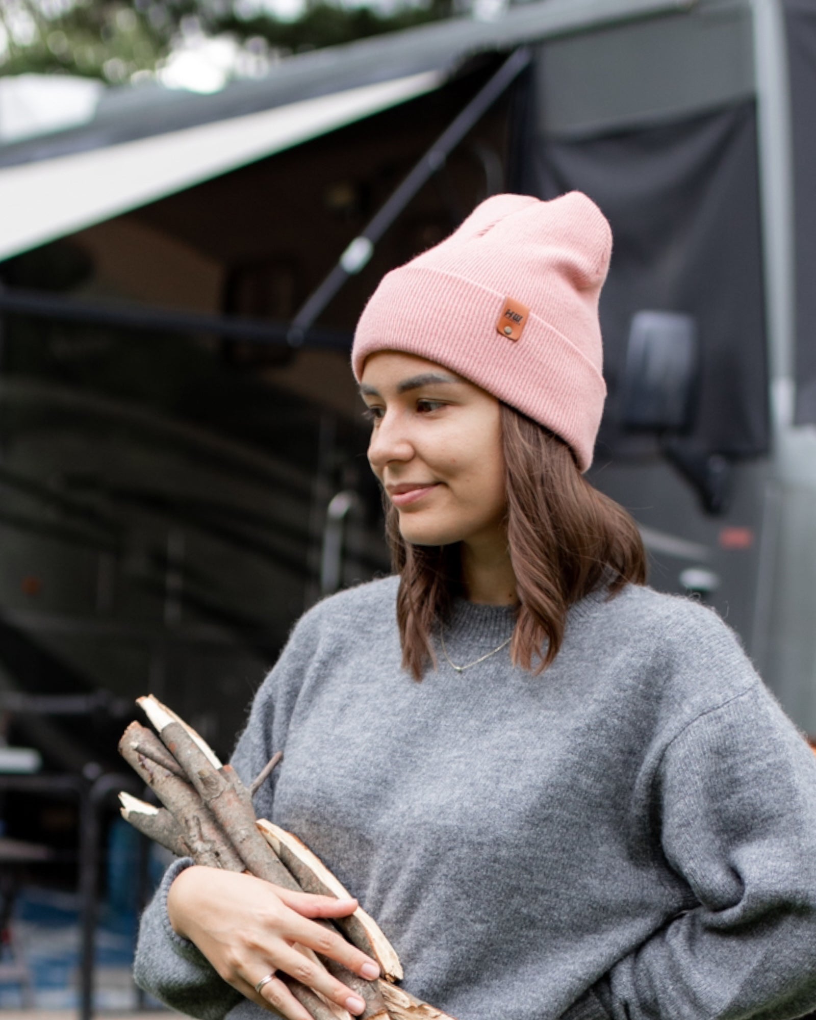 Azure Arrowwood HAAKWEAR knit cuffed beanie in pearl pink, showcasing soft, cozy knit fabric and a snug fit for cold weather.