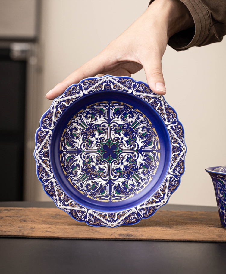 Elegant Chinese porcelain teapot and saucer gift set with intricate silver filigree craftsmanship in imperial blue by Goseung.