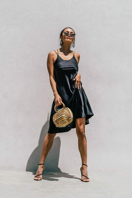 Black Florida minimal satin slip dress for women by Azure Thanatos, showcasing sleek, smooth fabric and elegant fit.
