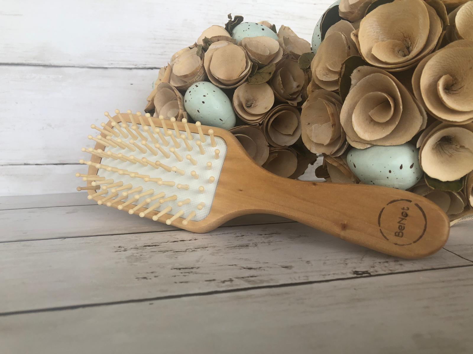 Violet Atlas wooden detangling hair brush with ergonomic handle, gentle teeth for smooth, tangle-free hair care in bath and beauty routine