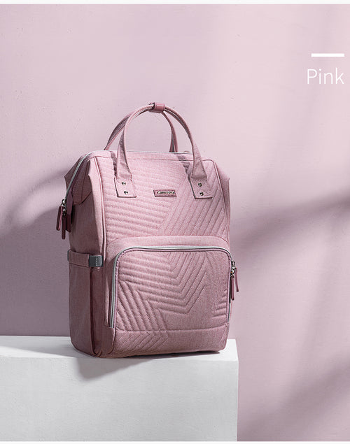 Modern quilted diaper bag backpack for kids and babies by Maroon Chronos, featuring multiple compartments and padded straps.