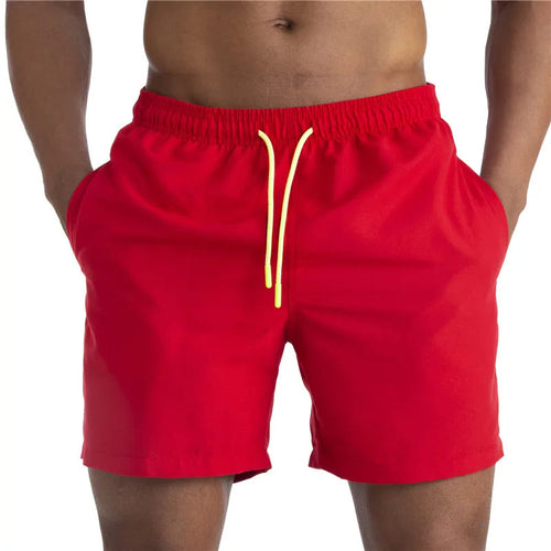 Raspberry Eurybia Sunga Beach Shorts swimwear with vibrant pattern and comfortable fit, perfect for beach and poolside wear.