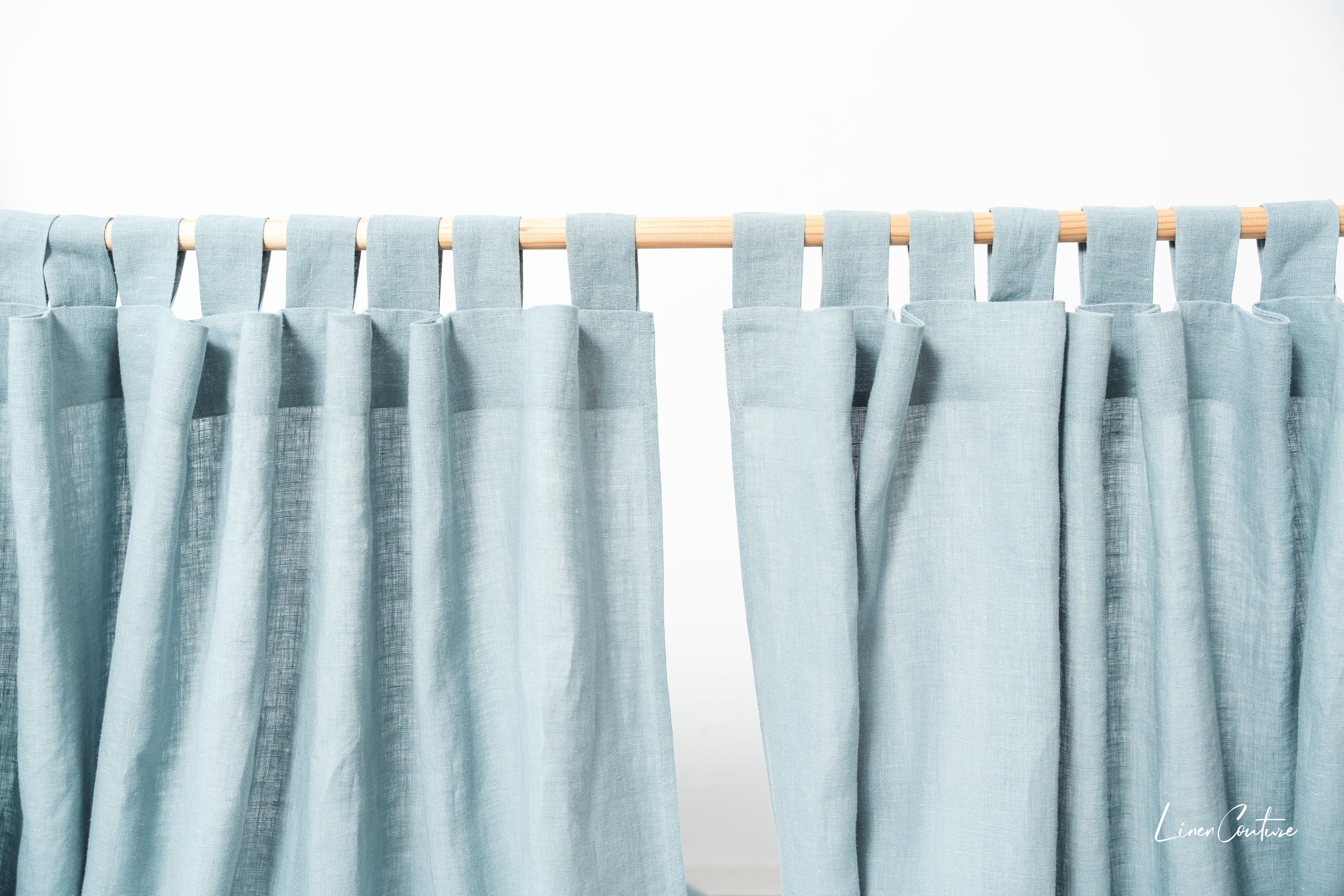 Greyish mint linen curtain with tab top design from Magenta Sugarplum, ideal for stylish home decor.