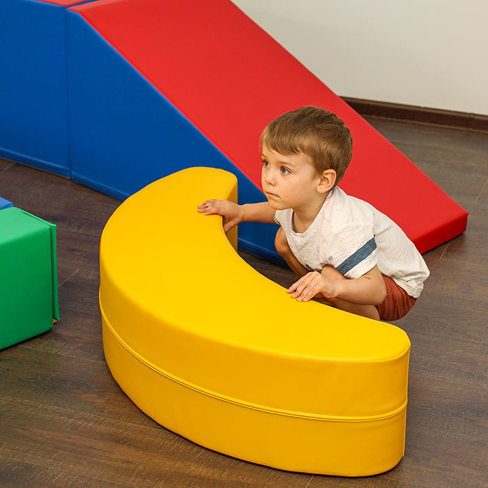 Blush Apricot Iglusoftplayr banana-shaped furniture piece for children, soft and colorful for playful indoor use.