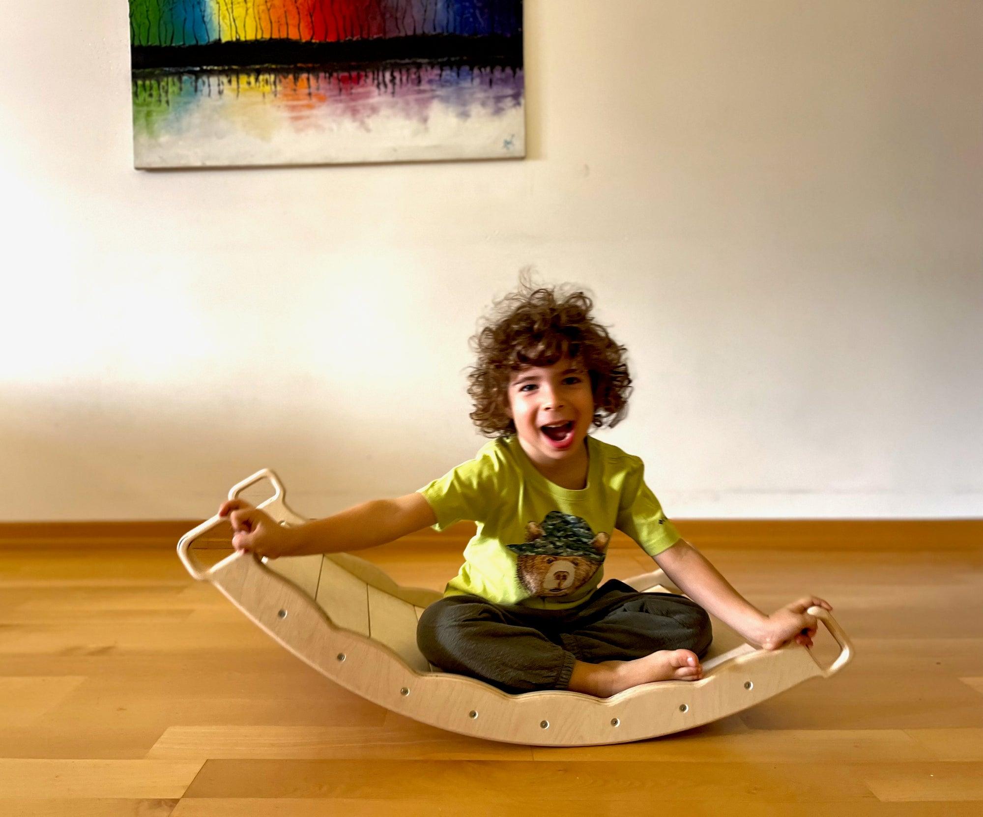 Red Oceanus XL wooden balance board with pillow, versatile furniture piece for relaxation and stability practice.