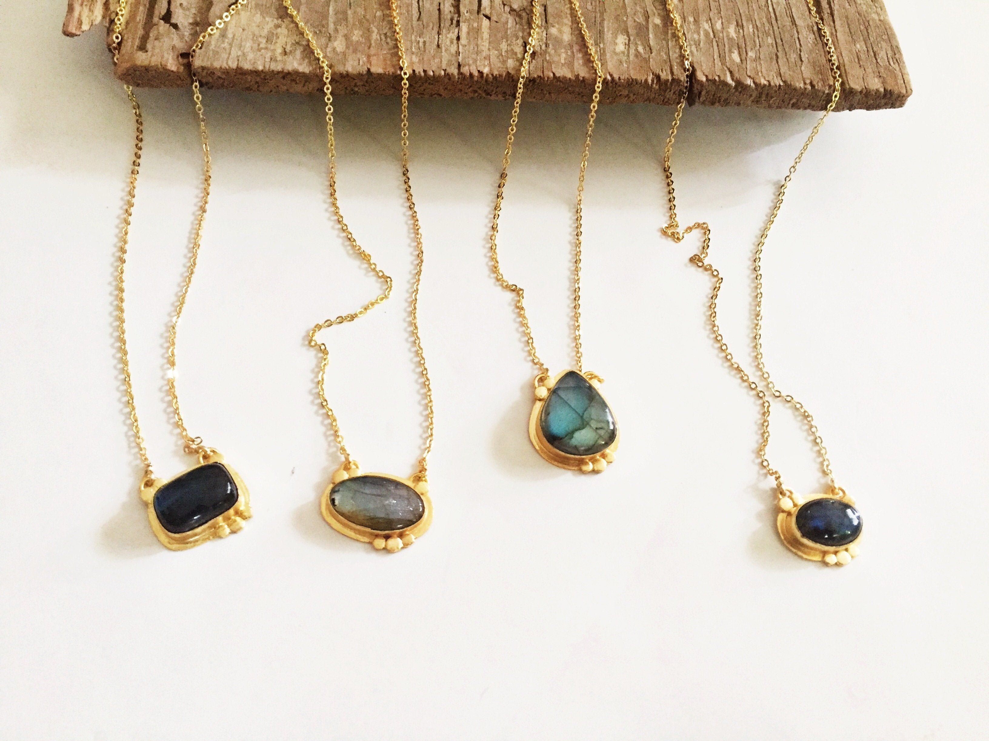 Agadir Labradorite pendant from Violet Baobab jewelry collection, showcasing a iridescent gemstone on a silver chain.