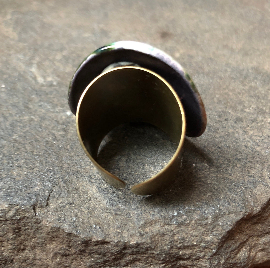 Adjustable handmade ceramic cocktail ring in teal by Azure Nesoi, featuring a bold statement design and unique craftsmanship.