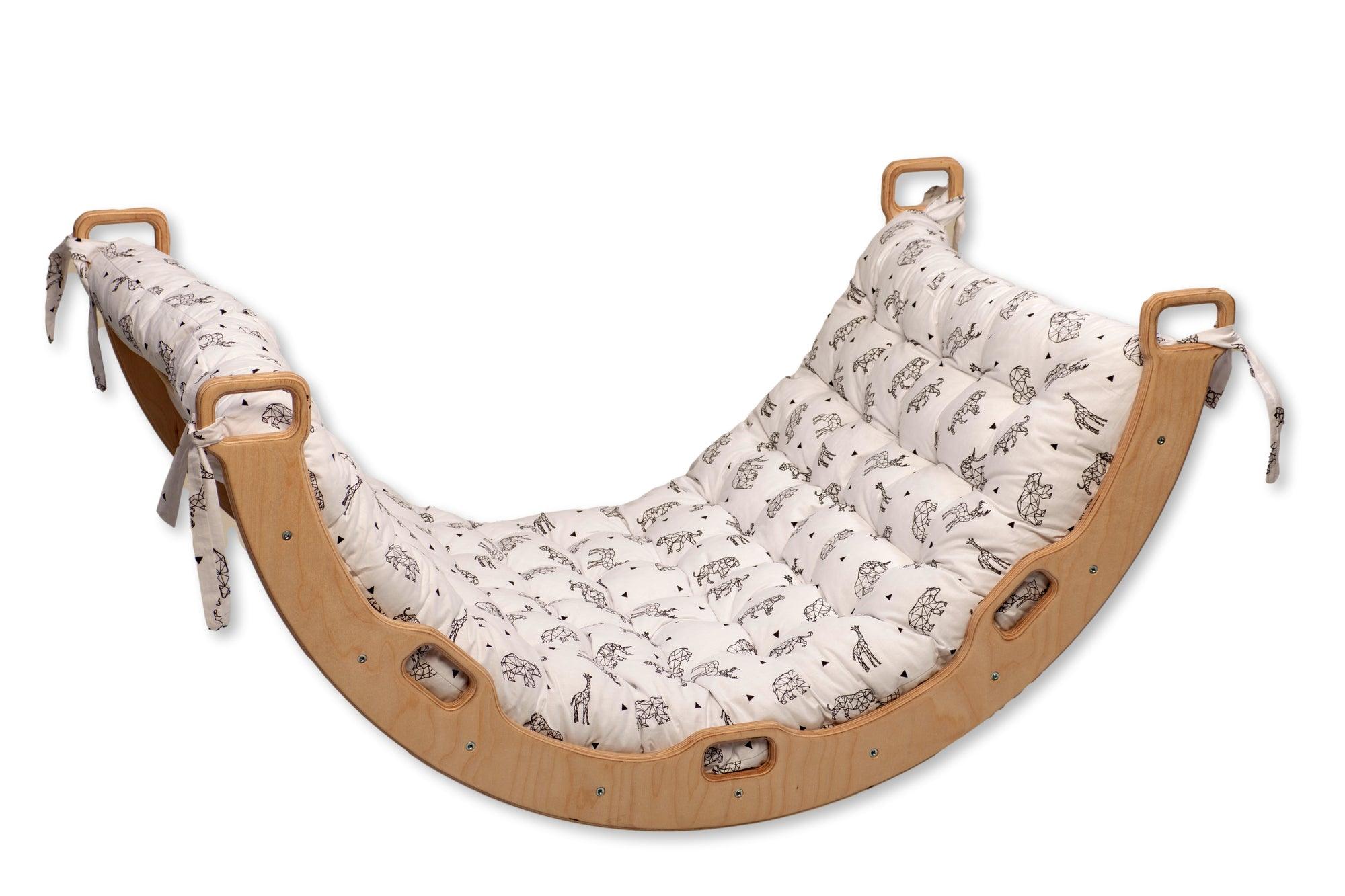 Red Oceanus climbing arch with origami pattern pillow, modern furniture piece for play and relaxation, featuring colorful geometric design.