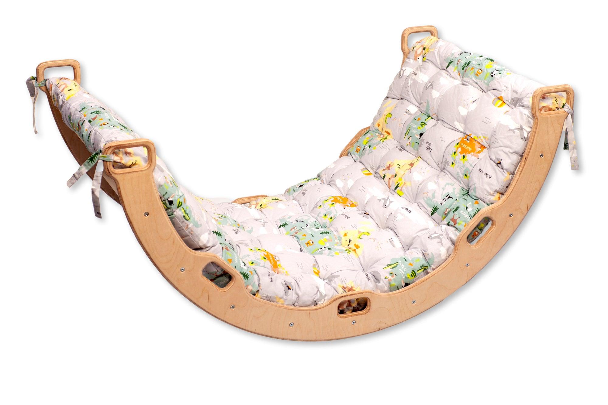 Red Oceanus climbing arch with a colorful map pattern pillow, designed as playful furniture for kids&