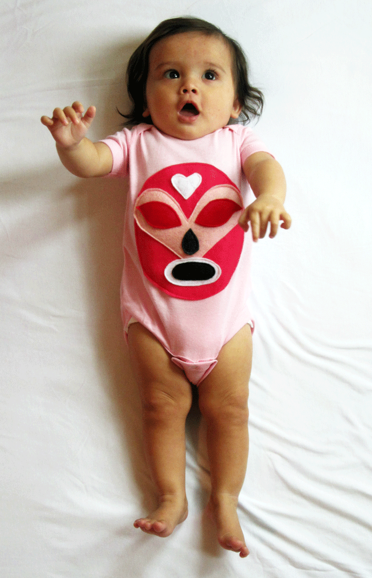 Pink Mexican wrestler baby onesie featuring a luchador Rosa design, by Sky Blue Milo, perfect for adorable baby clothing.