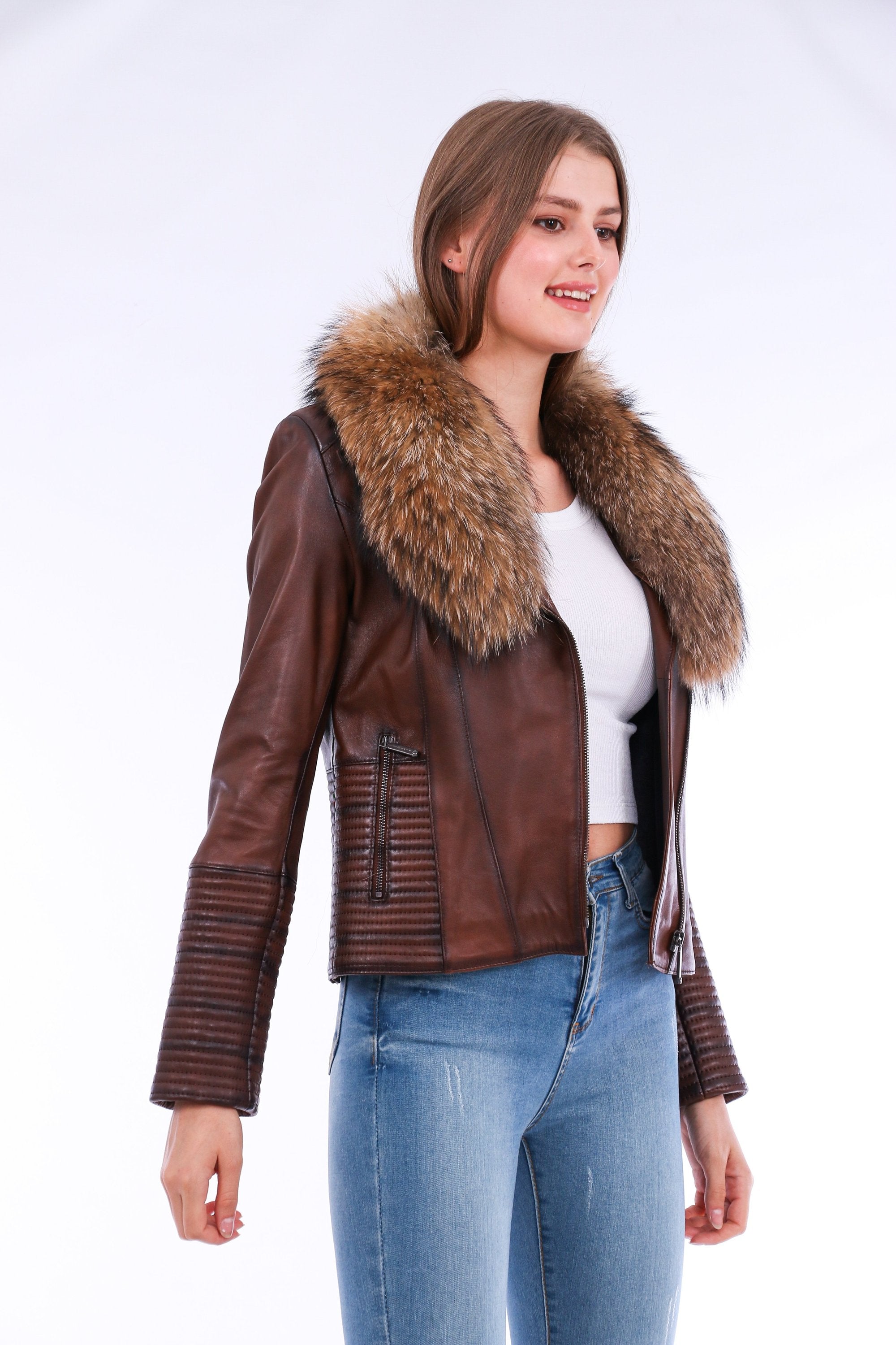Brown Ravenna leather biker jacket by Sangria Iapetus featuring classic lapels and metallic zipper details on a hanger.