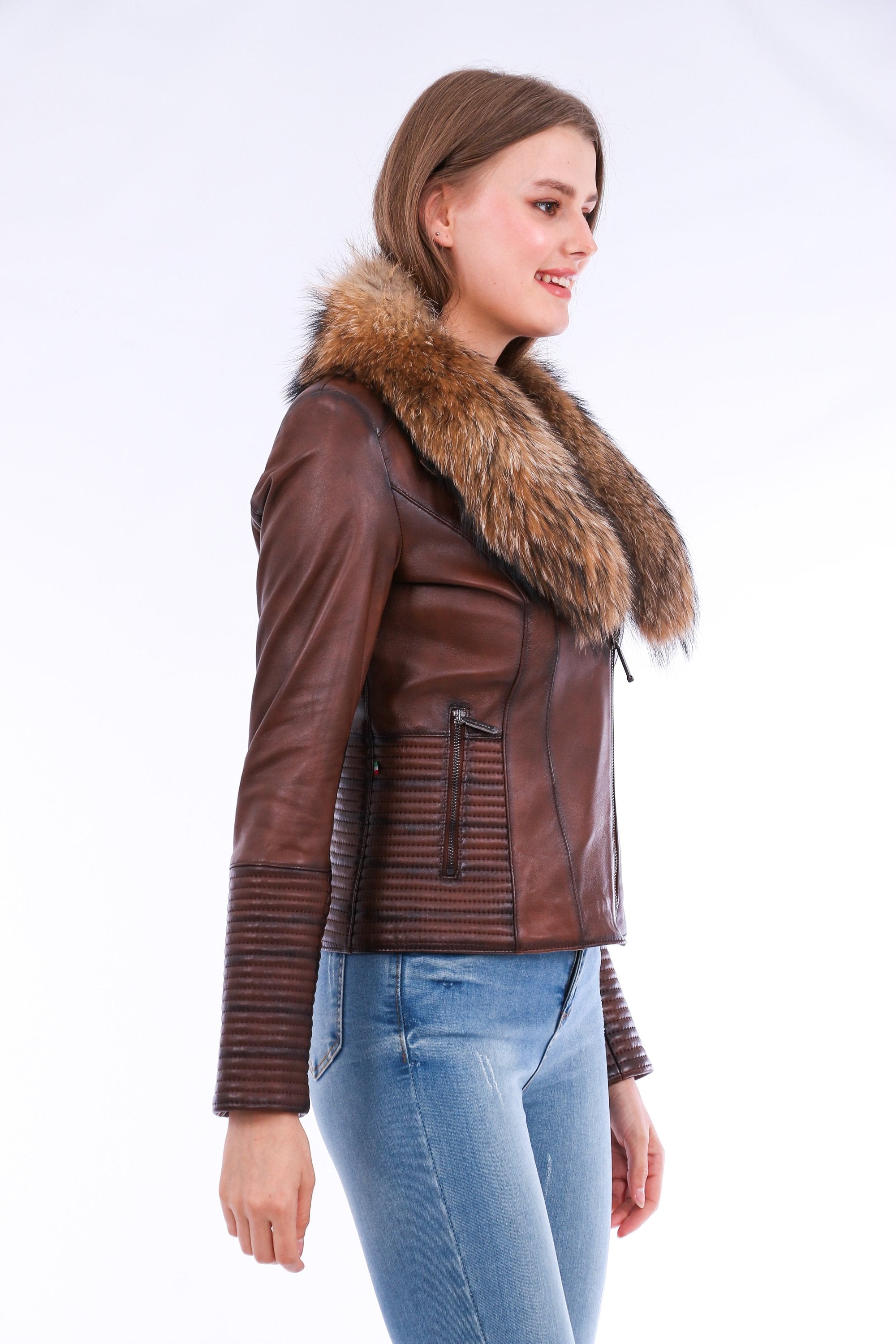Brown Ravenna Leather Biker Jacket by Sangria Iapetus displayed on a hanger with visible zipper details and classic biker design.