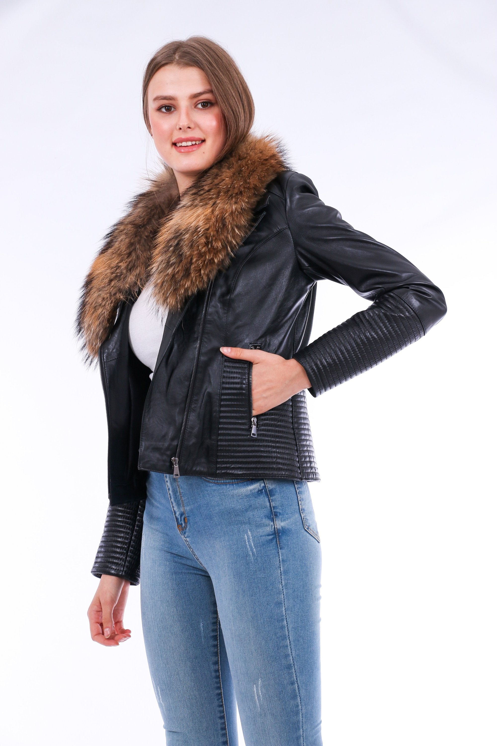 Black Ravenna Leather Biker Jacket by Sangria Iapetus with silver hardware, displayed on a hanger.