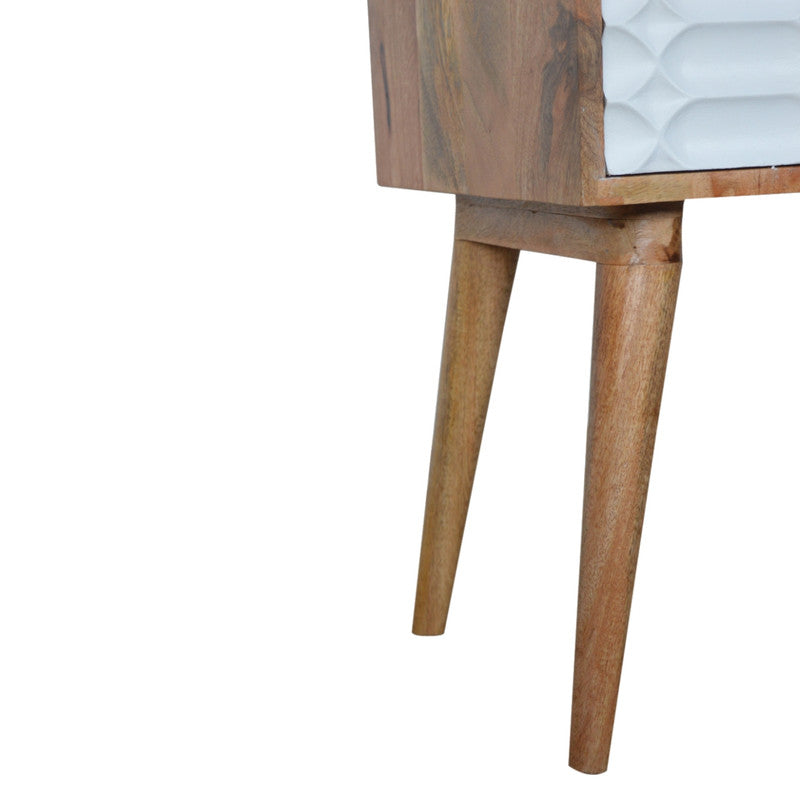 Capsule carved bedside table by Jade Epimetheus, showcasing intricate woodwork and a smooth, curved design in a modern furniture style.