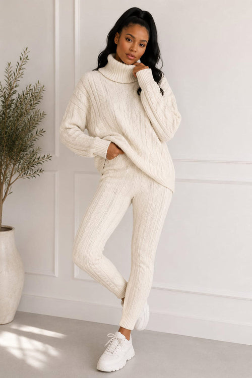 Women’s chunky knitted ribbed polo high neck top and leggings loungewear set by Coffee Diomedes, shown in beige on a model.