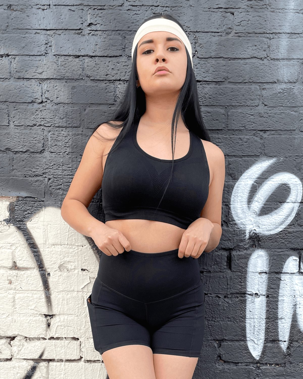 Black Lavender Jolie high-waisted athletic shorts with hip pockets, shown in black, designed for activewear and workout comfort.