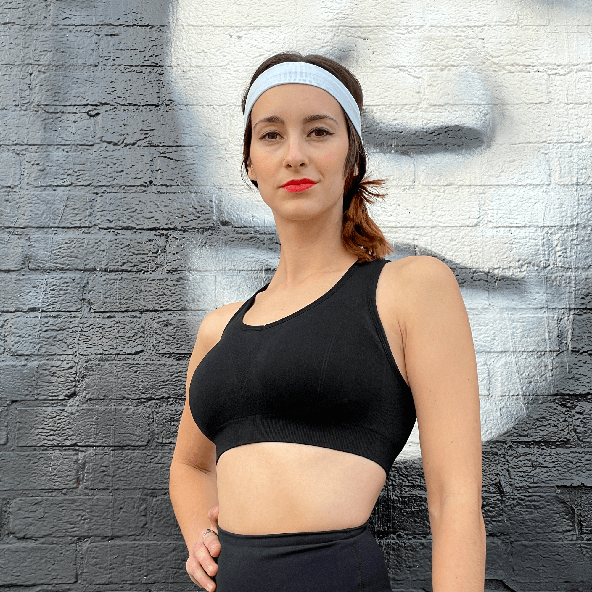 Black Lavender La Vittoria Racerback Athletic Sports Bra shown in black, featuring a supportive racerback design for activewear.