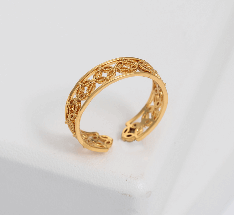 Gold Hélodie ring from Lime Cress Jewelry & Watches collection, featuring a sleek, elegant design with a smooth band.