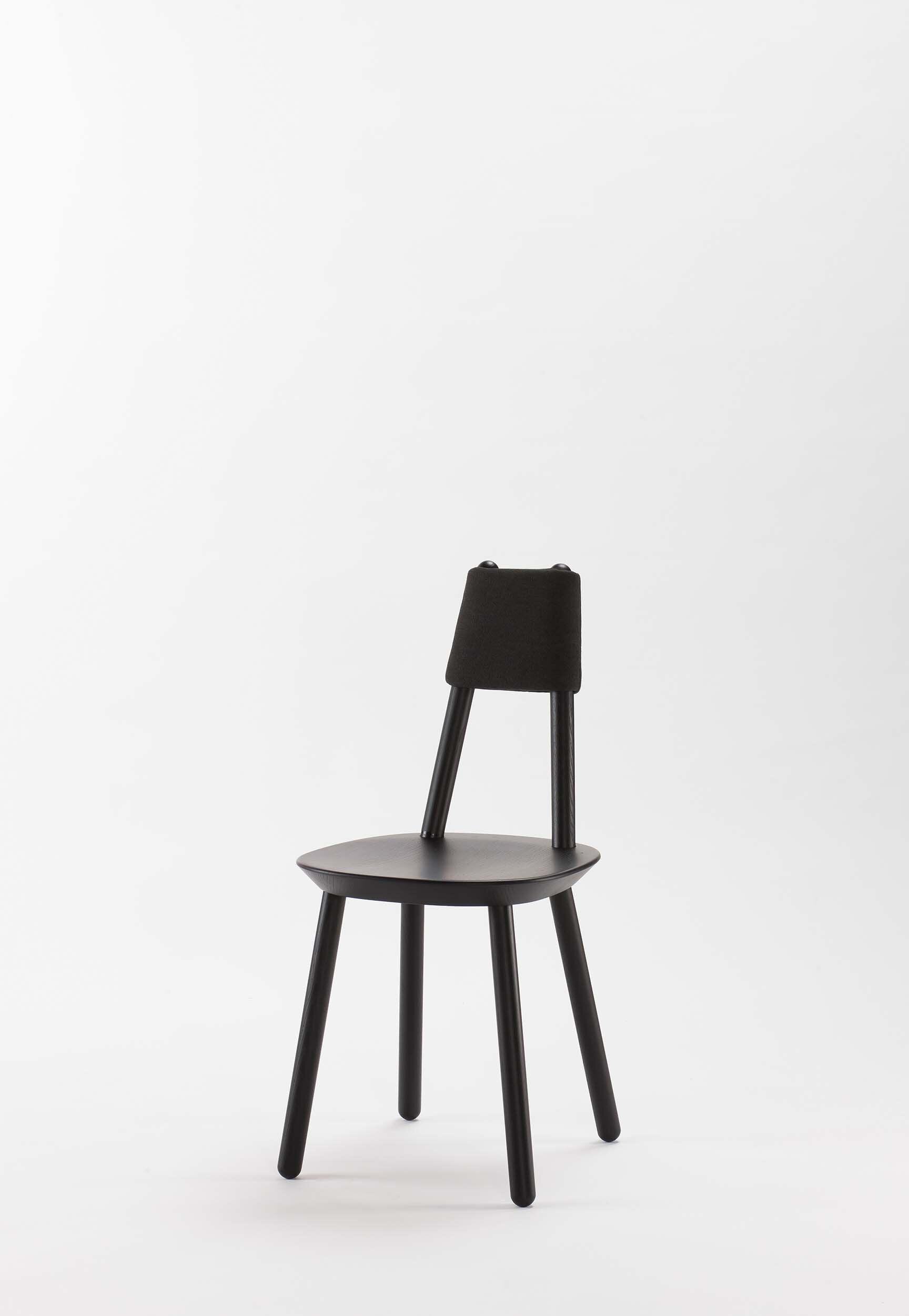 Naïve black dining chair from Aquamarine Poppy with a modern, sleek design and upholstered seat, ideal for contemporary dining rooms.