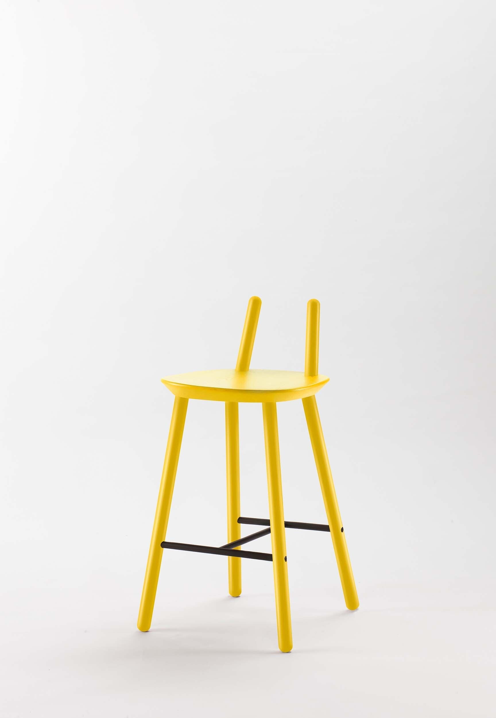 Yellow Naïve Semi Bar Stool by Aquamarine Poppy, featuring modern furniture design with a sleek, curved seat and metal legs.