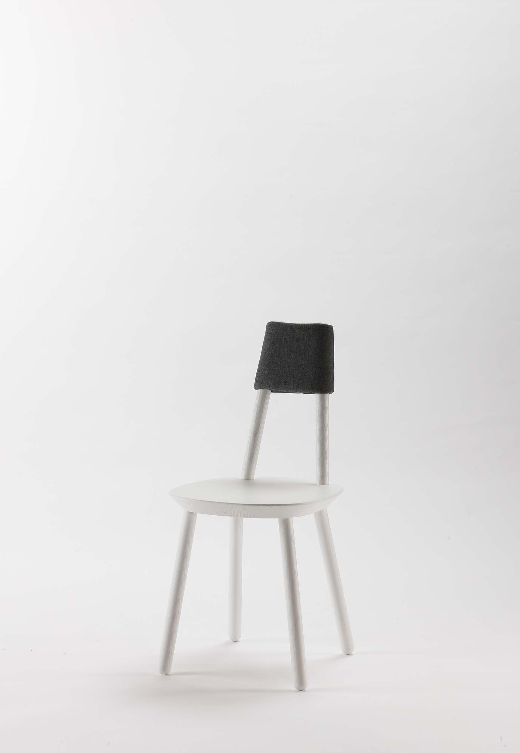 Naïve Dining Chair by Aquamarine Poppy, white upholstered furniture with sleek modern design and wooden legs.
