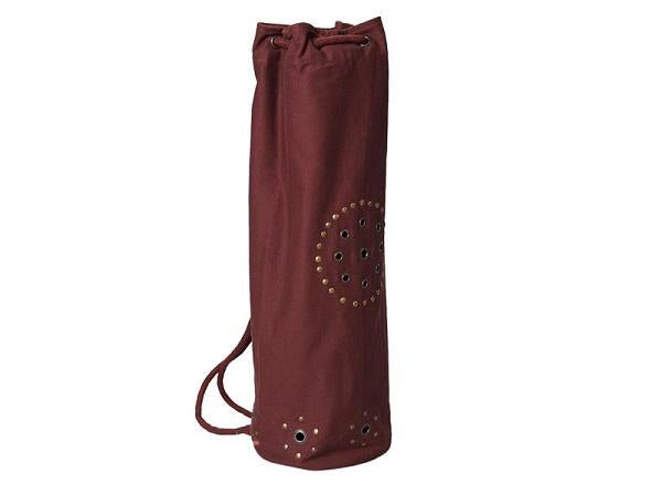 Chocolate-colored OMSutra OM Mahashakti yoga mat bag made of soft fabric, designed for carrying yoga accessories.