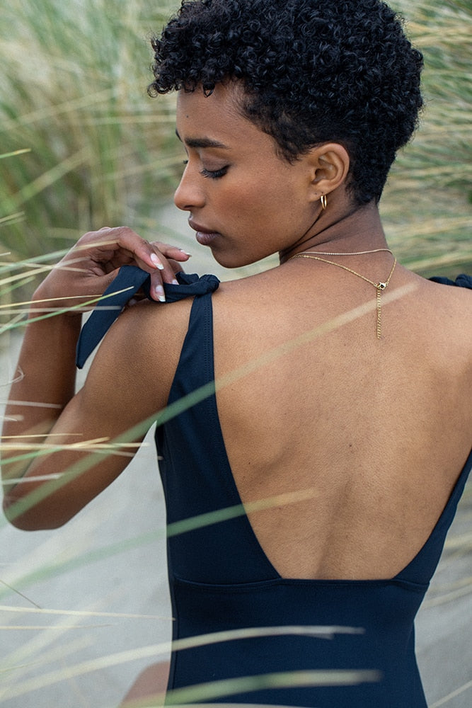 Black Egee one-piece swimsuit by Silver Daedalus, eco-friendly lingerie and underwear with sleek, modern design.