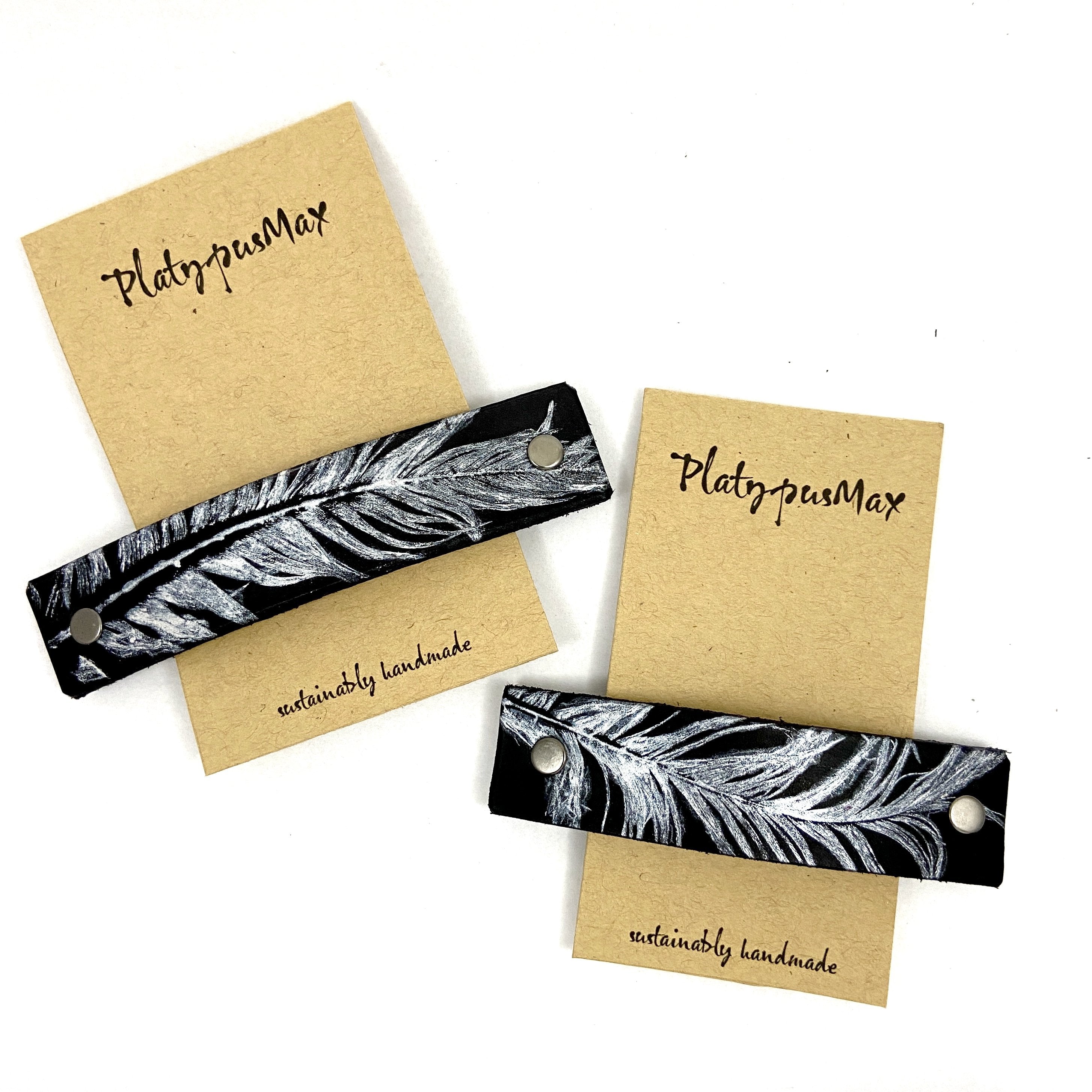 Silver feather hair barrette on black leather, stylish hair accessory by Orange Themis.