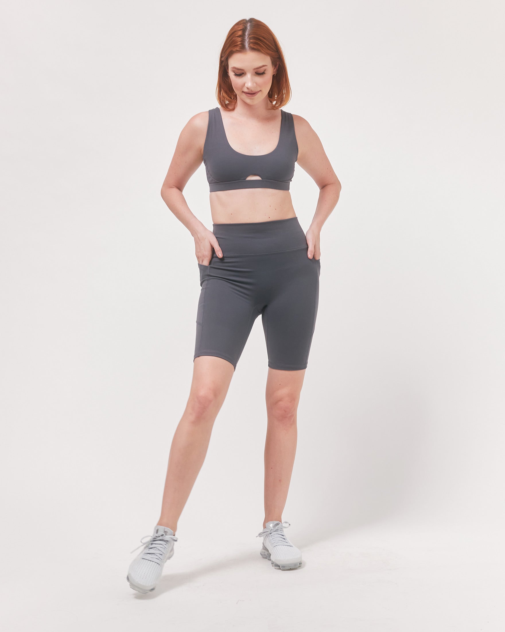 Lemon Molly Making Moves pocket biker shorts for women, 8.5-inch length, in smoke color, featuring side pockets and a fitted design.