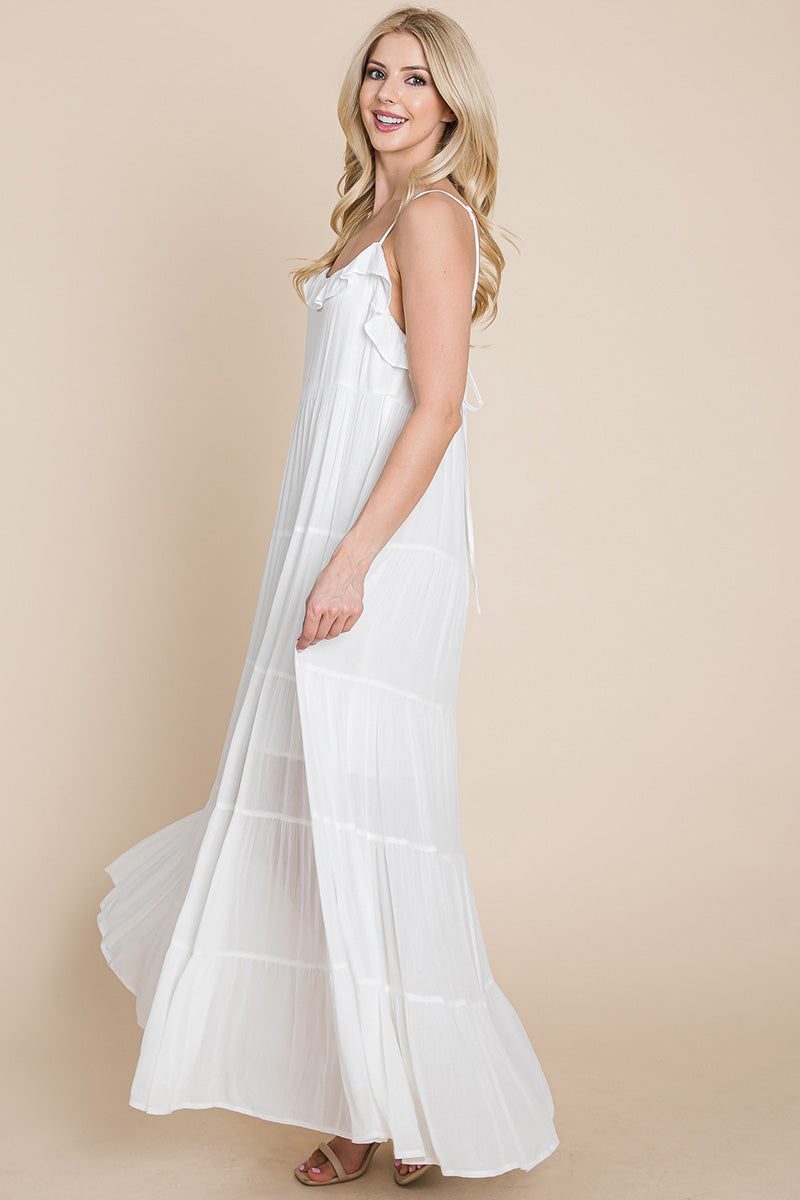 Cream tiered tie strap cami maxi dress for women by Aquamarine Gaia, featuring layered fabric and adjustable shoulder straps.
